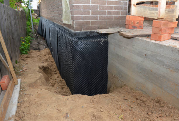SJ Waterproofing Pros technician performing targeted Waterproofing assessment in McEwen, TN